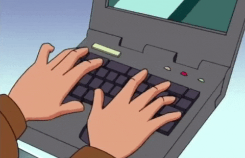 A person is typing on a laptop